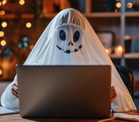 Ghosty at a computer